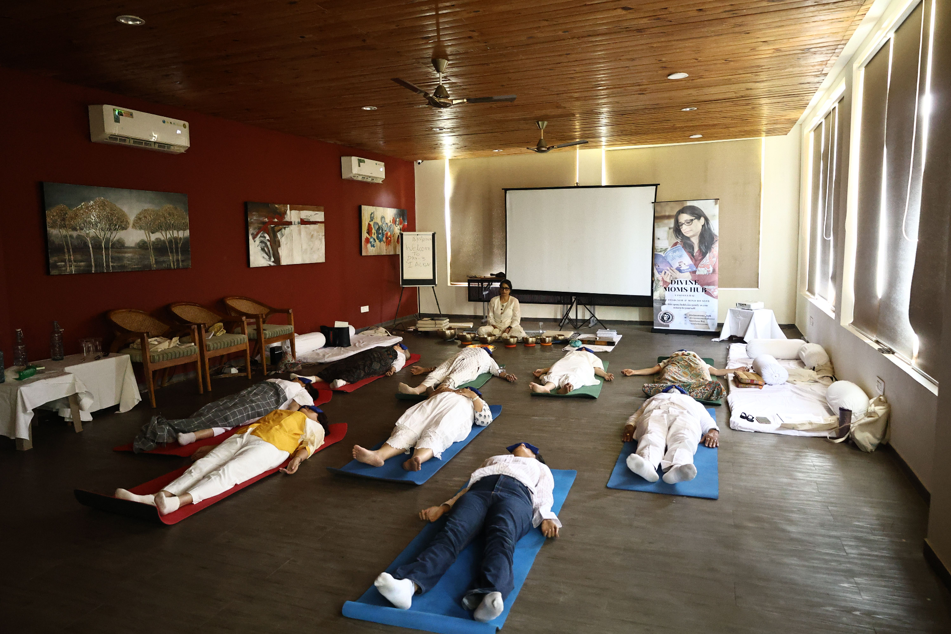 Retreat participants resting on mats during a guided healing session