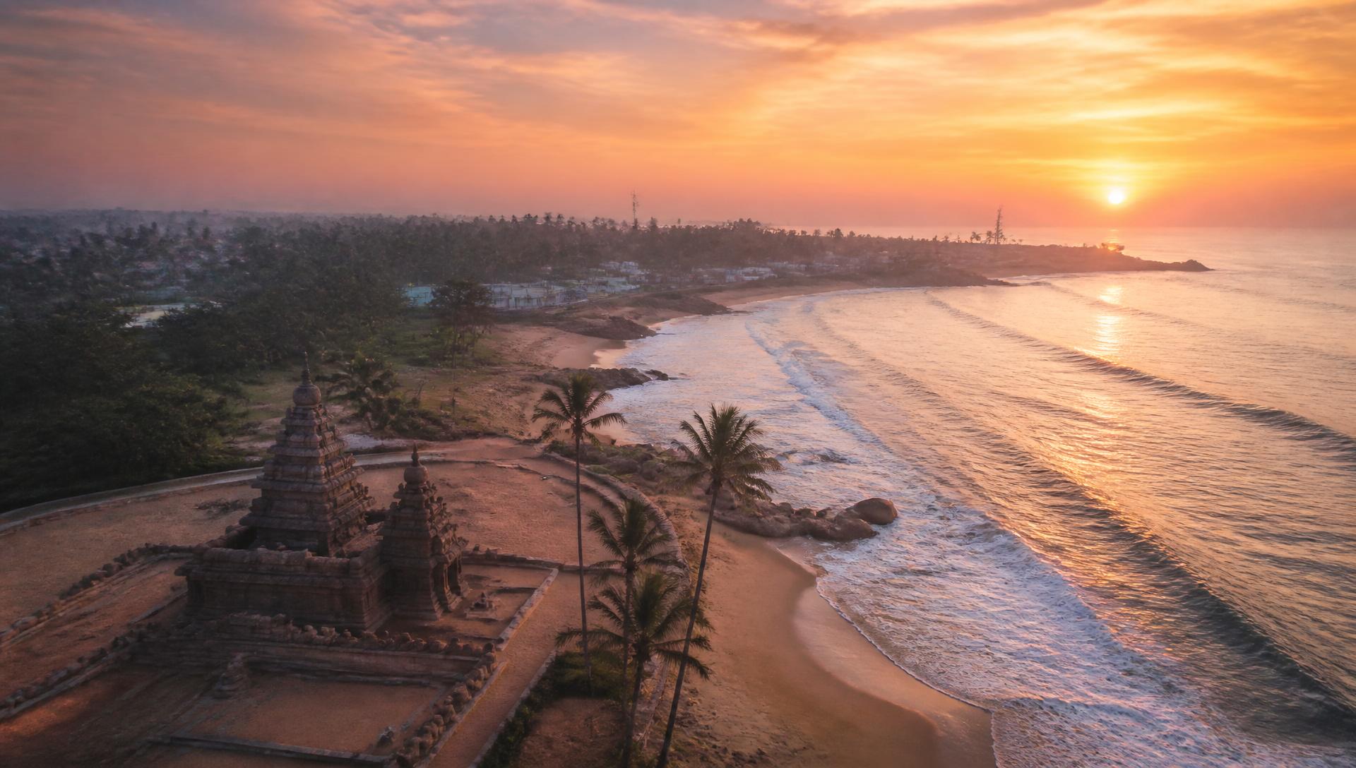 Sunrise over the Mahabalipuram shore temple and coastline